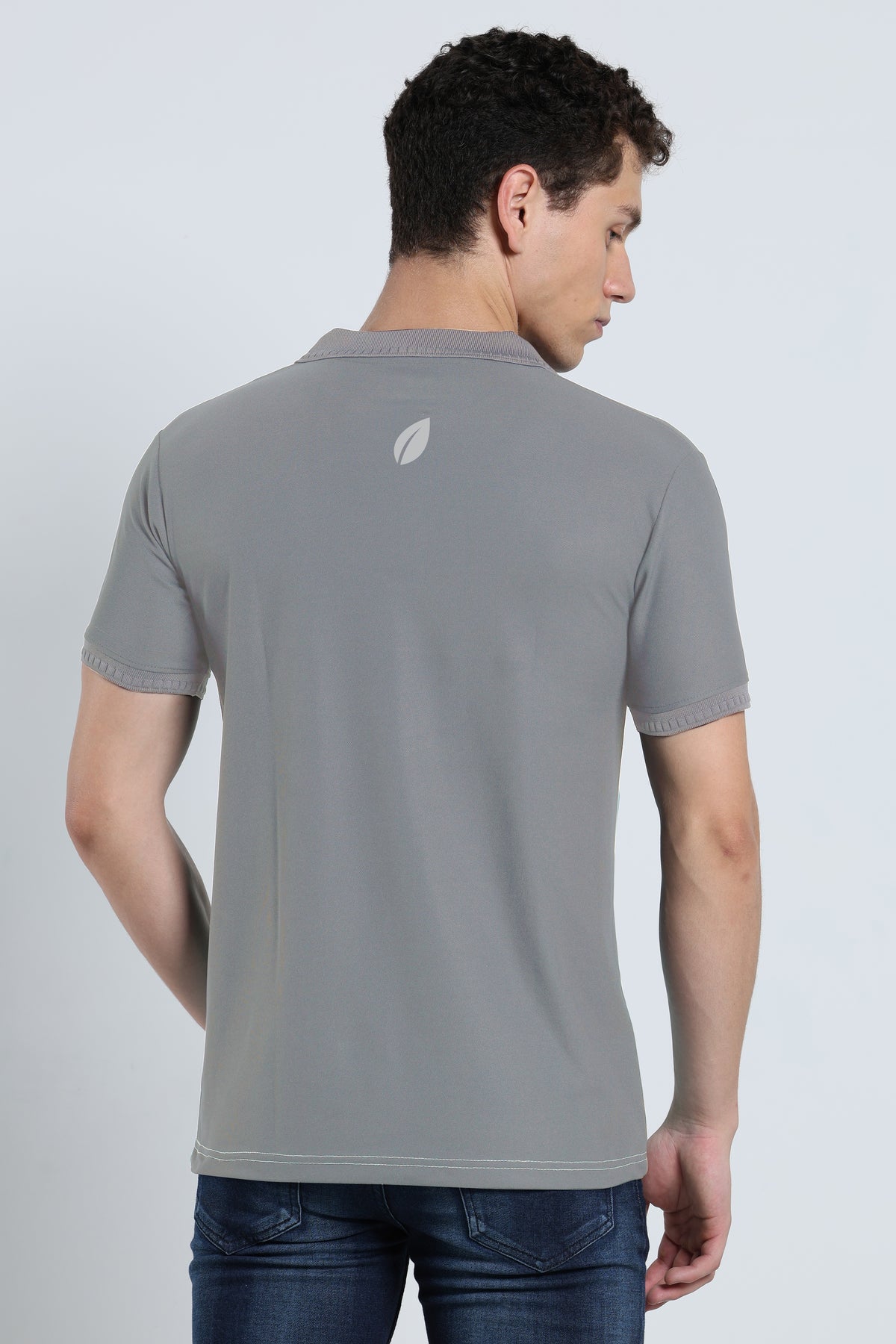 Back view of men's grey activewear polo t-shirt with subtle branding